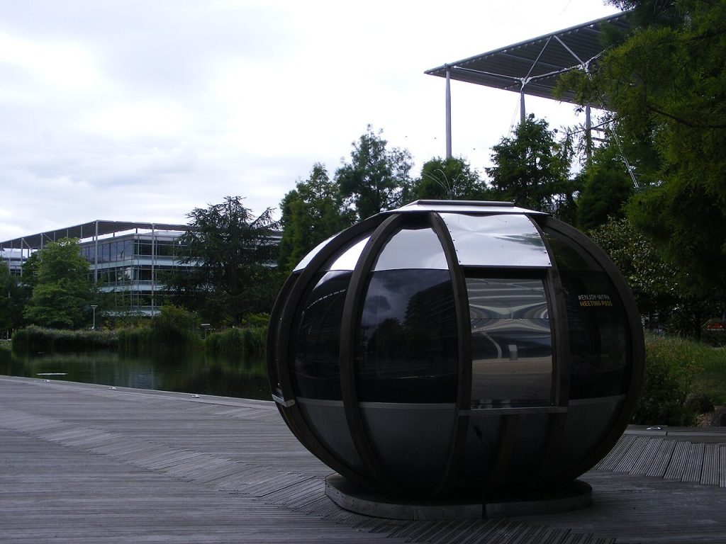 83% of CFOs Say AI Projects Show No Measurable Results Glass meeting pod at a modern business park